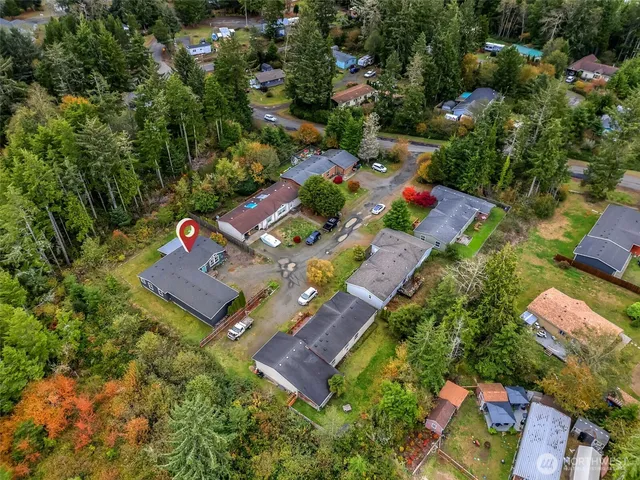 an aerial view of a house with yard swimming pool and outdoor seating