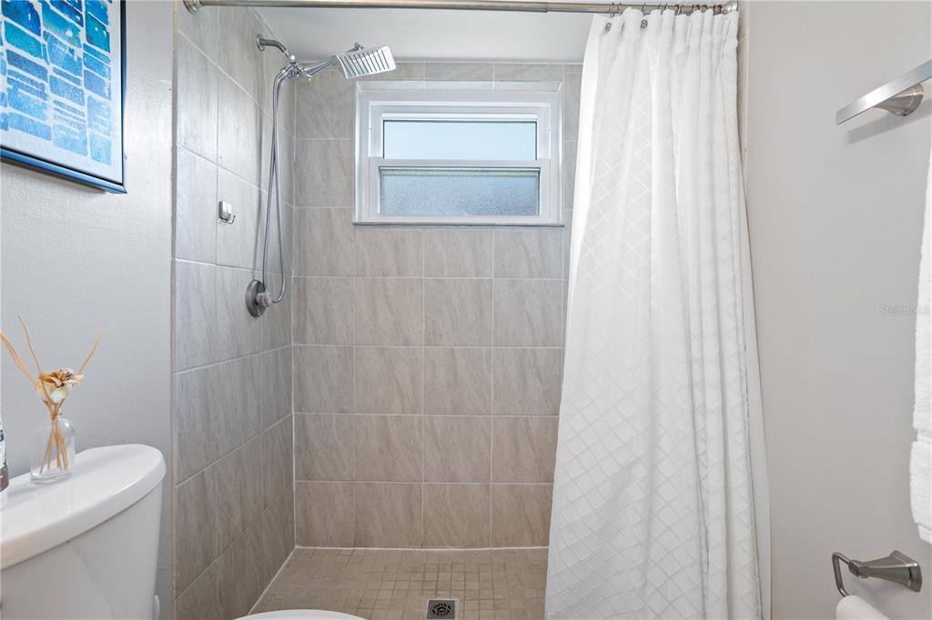 7550 Herricks Loop Orlando, FL 32835 - Photo 23 of 37 a bathroom with a shower curtain and a sink