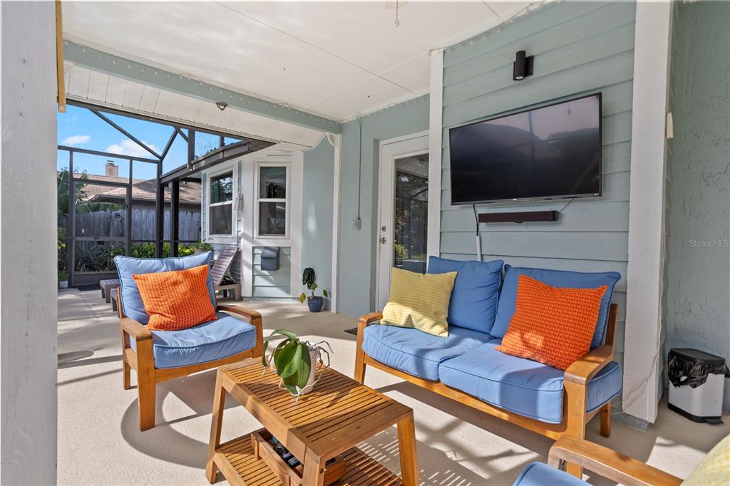 7550 Herricks Loop Orlando, FL 32835 - Photo 32 of 37 a outdoor living space with furniture and a flat screen tv