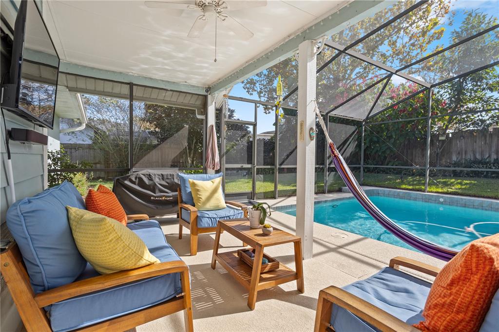 7550 Herricks Loop Orlando, FL 32835 - Photo 33 of 37 a view of a patio with a table chairs and a backyard