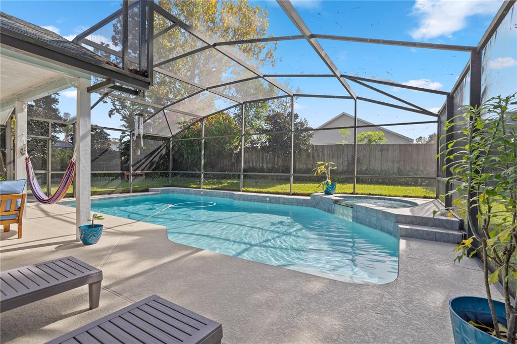 7550 Herricks Loop Orlando, FL 32835 - Photo 35 of 37 a view of a swimming pool with a patio and a yard