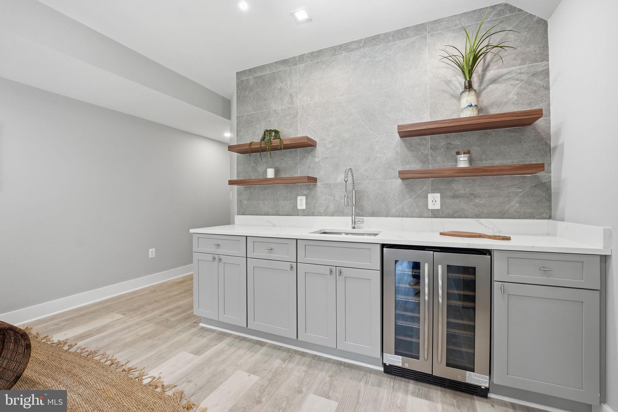 2211 Military Road Arlington, VA 22207 - Photo 91 of 107 Sleek modern wet bar with stylish shelves.