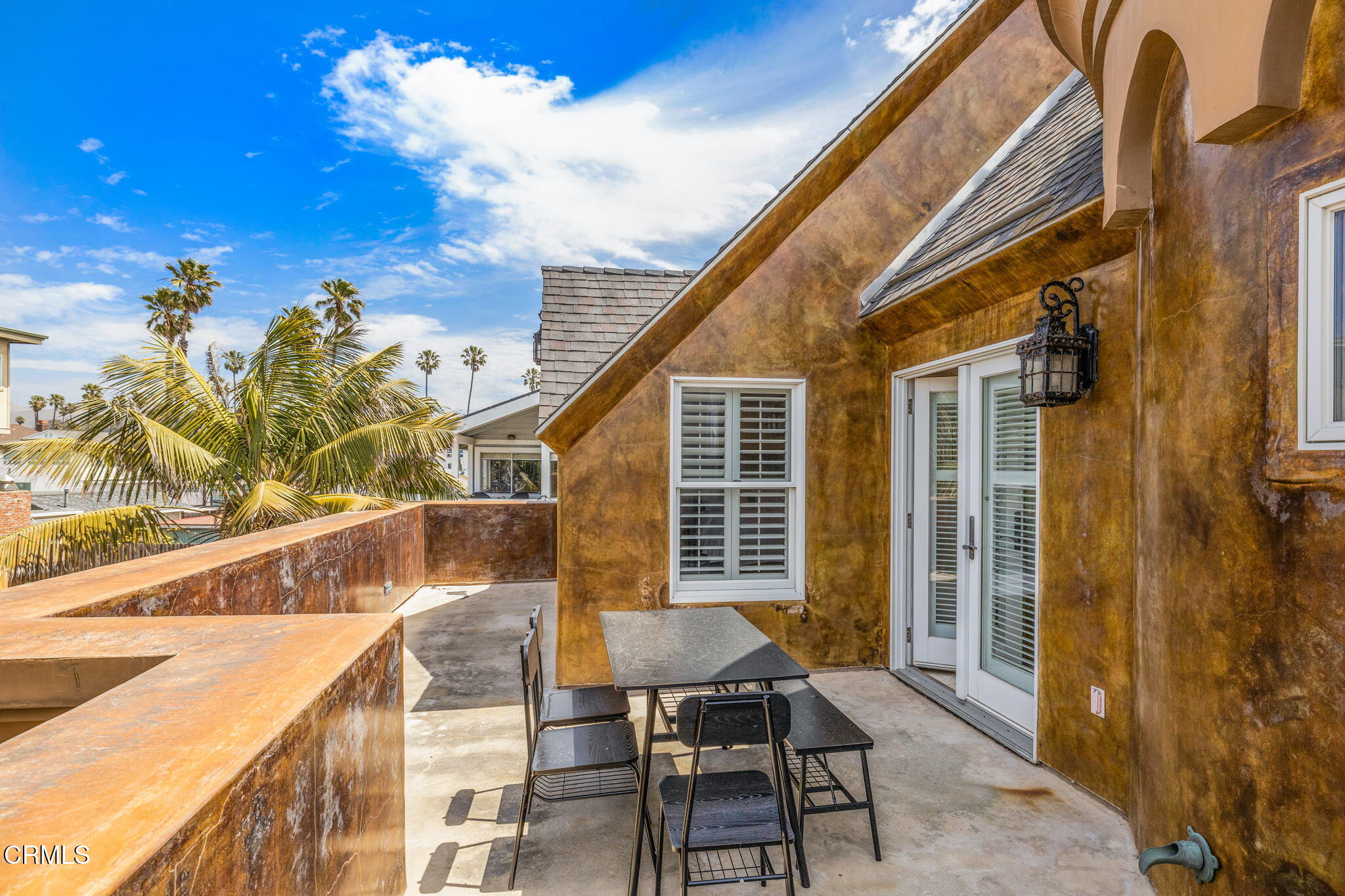 1206 Sagamore Lane Ventura, CA 93001 - Photo 14 of 19 a balcony with table and chairs