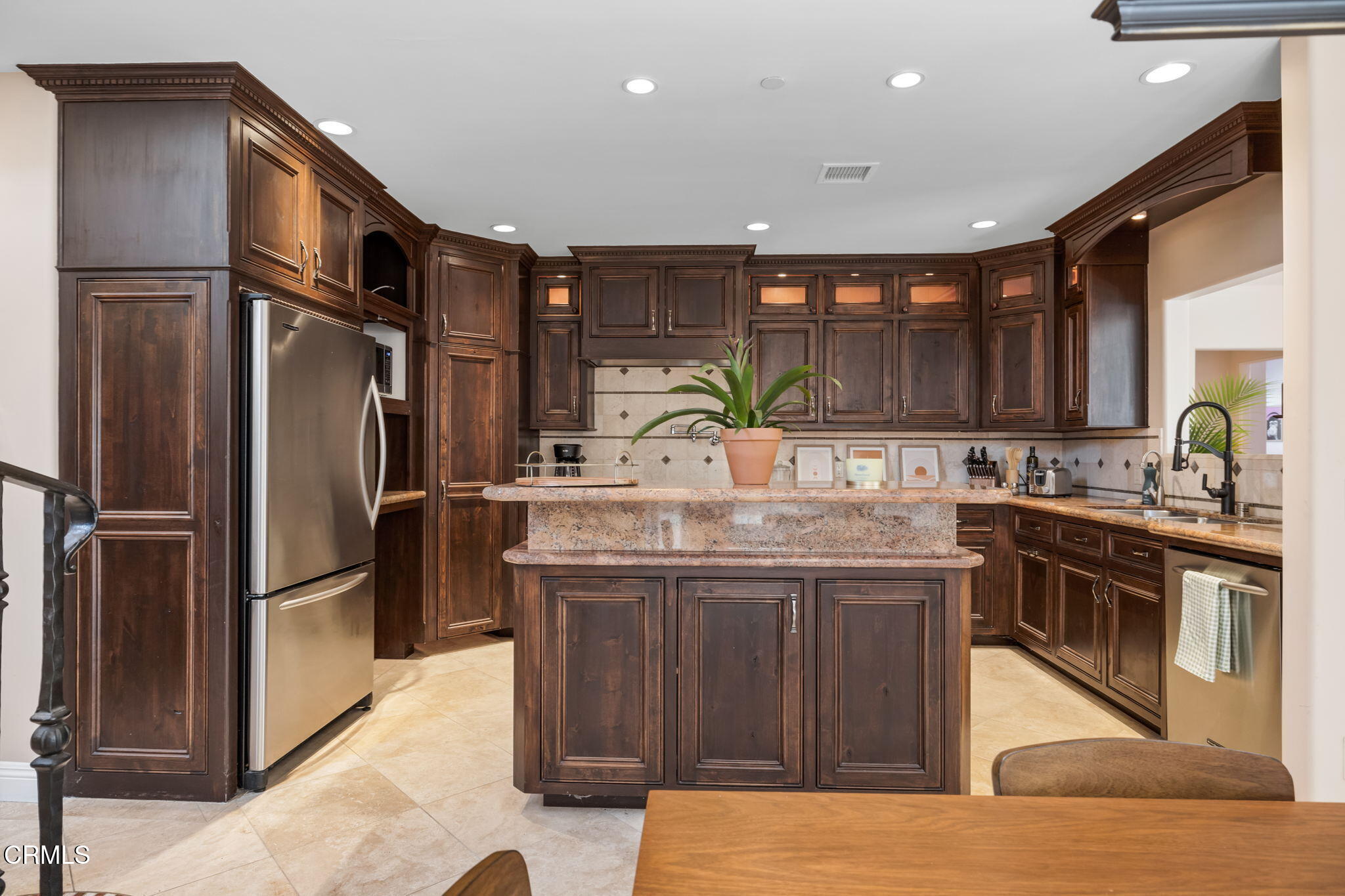 1206 Sagamore Lane Ventura, CA 93001 - Photo 4 of 19 a kitchen with stainless steel appliances granite countertop a refrigerator a sink and a stove