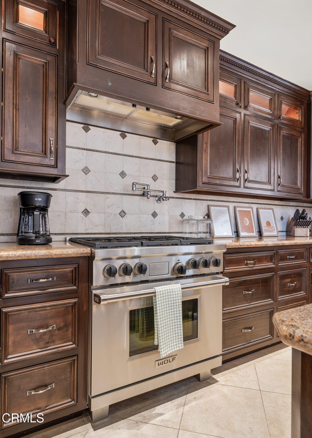 1206 Sagamore Lane Ventura, CA 93001 - Photo 5 of 19 a stove top oven sitting inside of a kitchen