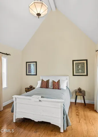 a bedroom with a bed and a table