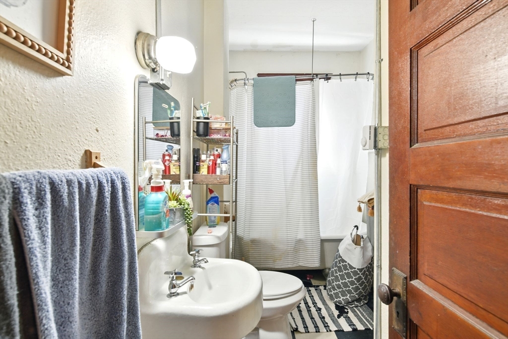 11 Conway Street Greenfield, MA 01301 - Photo 14 of 25 a bathroom with a sink toilet and shower