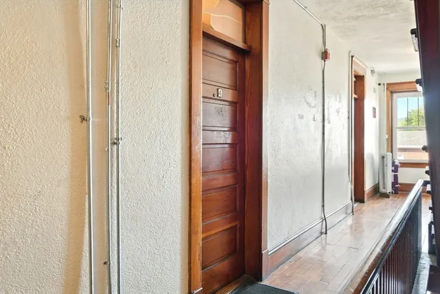a living room with furniture and floor to ceiling windows