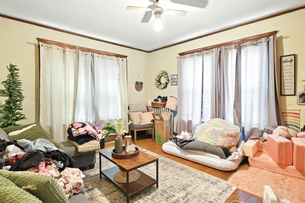 11 Conway Street Greenfield, MA 01301 - Photo 17 of 25 a living room with furniture and floor to ceiling windows