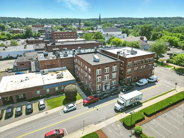 an aerial view of residential houses with city view