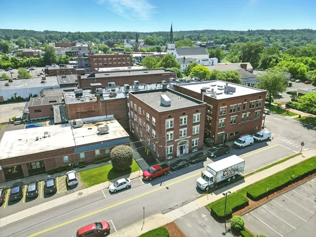 an aerial view of residential houses with city view