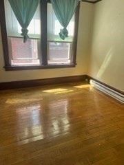 11 Conway Street Greenfield, MA 01301 - Photo 8 of 25 a view of a room with wooden floor and a window