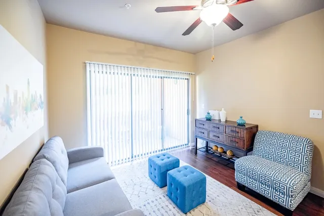 a living room with furniture and a large window