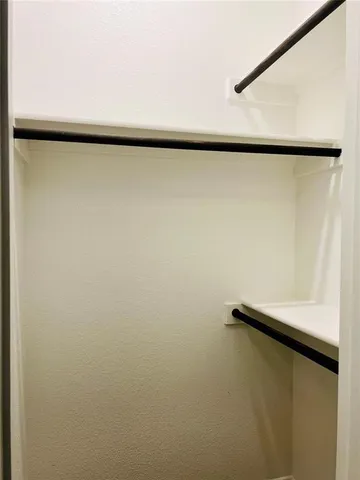 a view of a refrigerator in a painted room