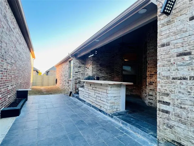 a view of open kitchen with a sink and cabinets