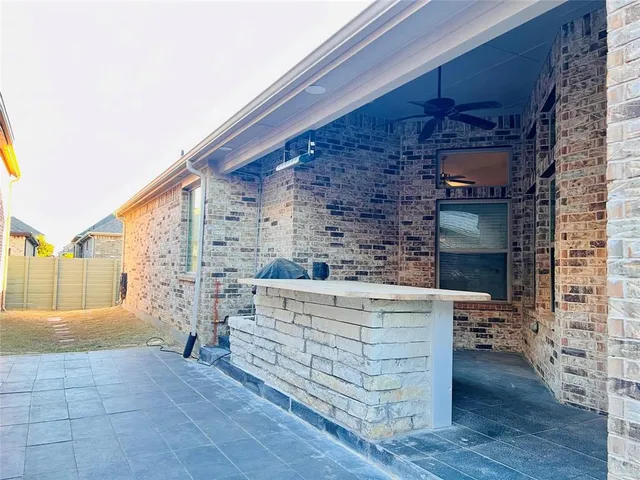 a view of open kitchen with cabinets