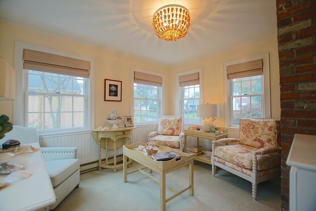 11 Shetland Road Marblehead, MA 01945 - Photo 11 of 28 a living room with furniture a table and a large window