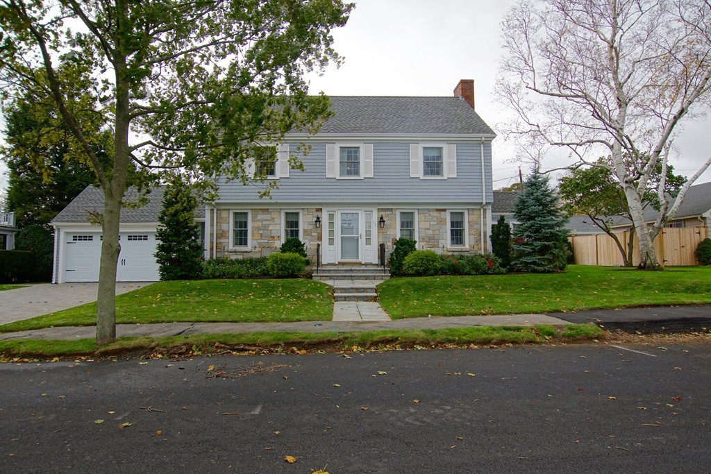 11 Shetland Road Marblehead, MA 01945 - Photo 2 of 28 a front view of a house with a yard and garage