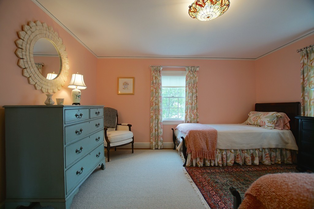 11 Shetland Road Marblehead, MA 01945 - Photo 23 of 28 a bedroom with a bed and a mirror