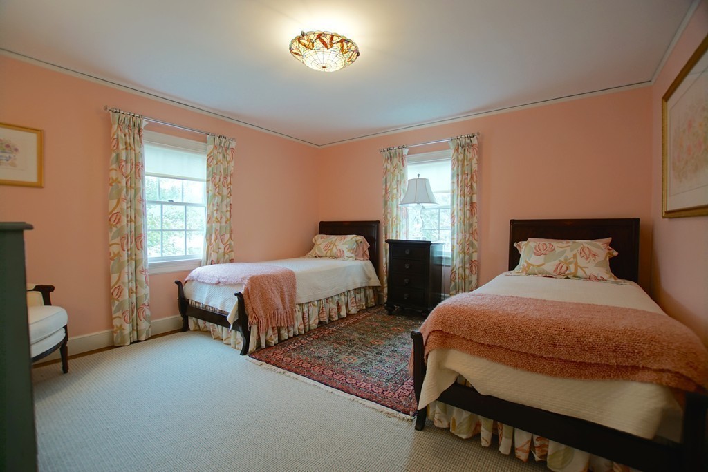 11 Shetland Road Marblehead, MA 01945 - Photo 24 of 28 a bedroom with two beds and a chair