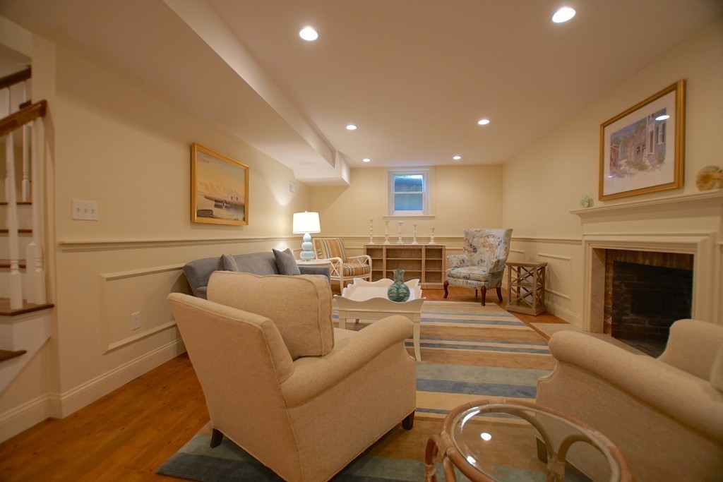 11 Shetland Road Marblehead, MA 01945 - Photo 25 of 28 a living room with furniture and a fireplace