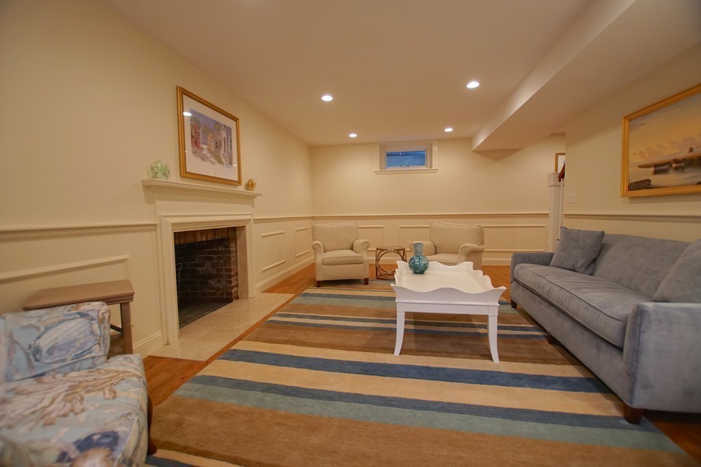 11 Shetland Road Marblehead, MA 01945 - Photo 26 of 28 a bedroom with furniture and a fireplace