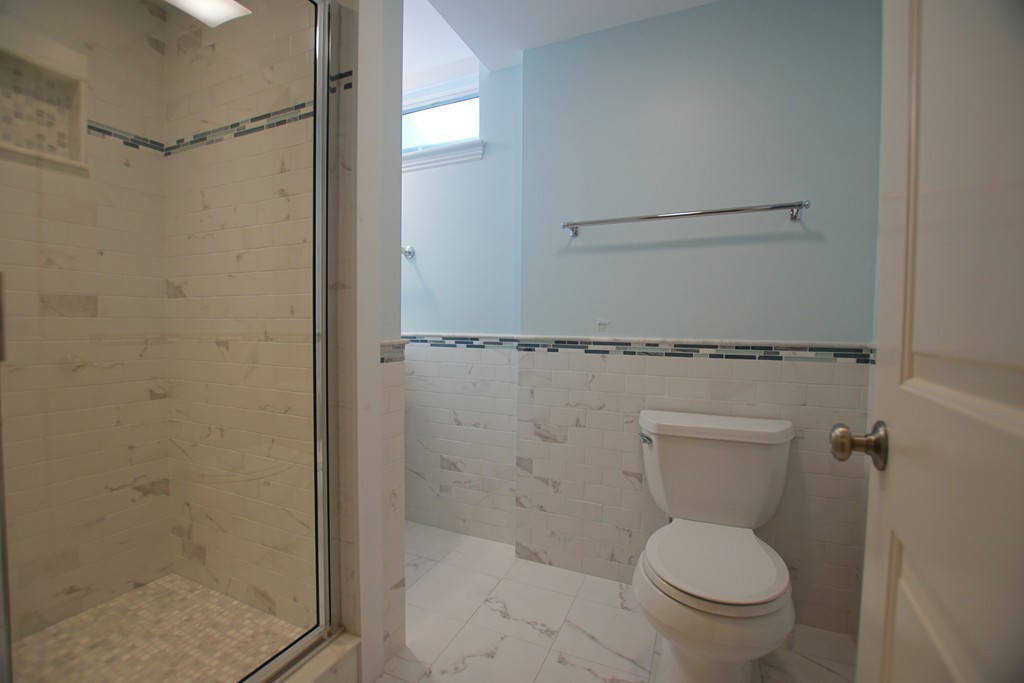 11 Shetland Road Marblehead, MA 01945 - Photo 27 of 28 a white toilet sitting next to a shower