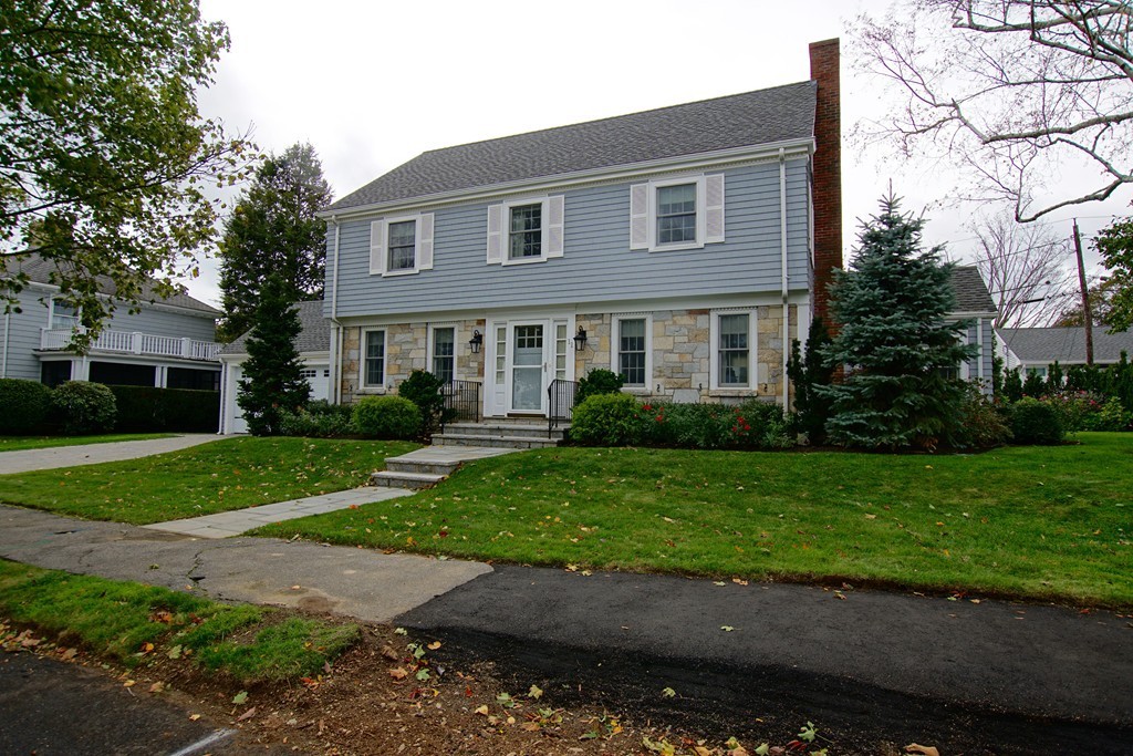 11 Shetland Road Marblehead, MA 01945 - Photo 3 of 28 a front view of a house with a yard and a garage