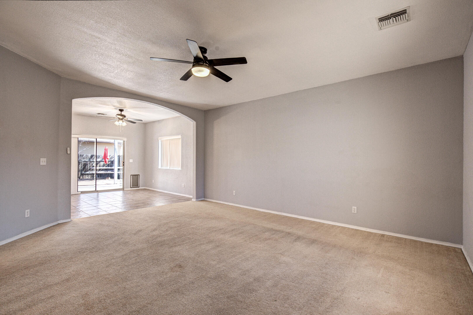 334 East Cedar Mill Road Star Valley, AZ 85541 - Photo 6 of 32 a view of a livingroom with a ceiling fan and window