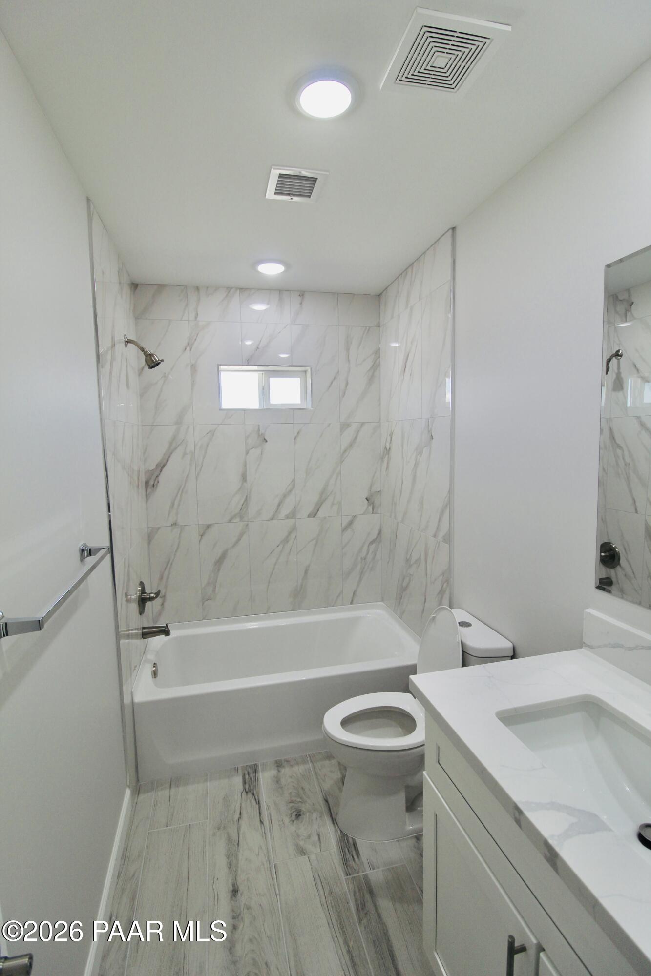 20275 East Mesa Verde Road Mayer, AZ 86333 - Photo 15 of 34 a bathroom with a sink a toilet and shower