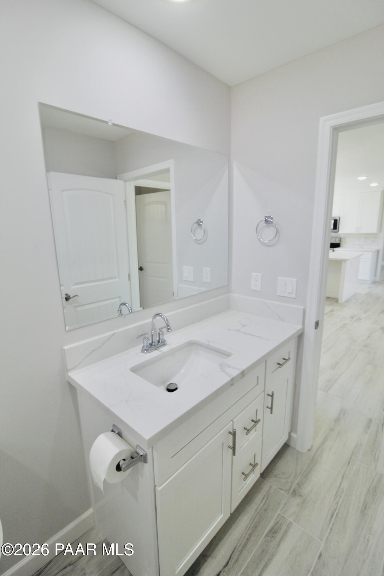 20275 East Mesa Verde Road Mayer, AZ 86333 - Photo 16 of 34 a bathroom with a sink and a mirror