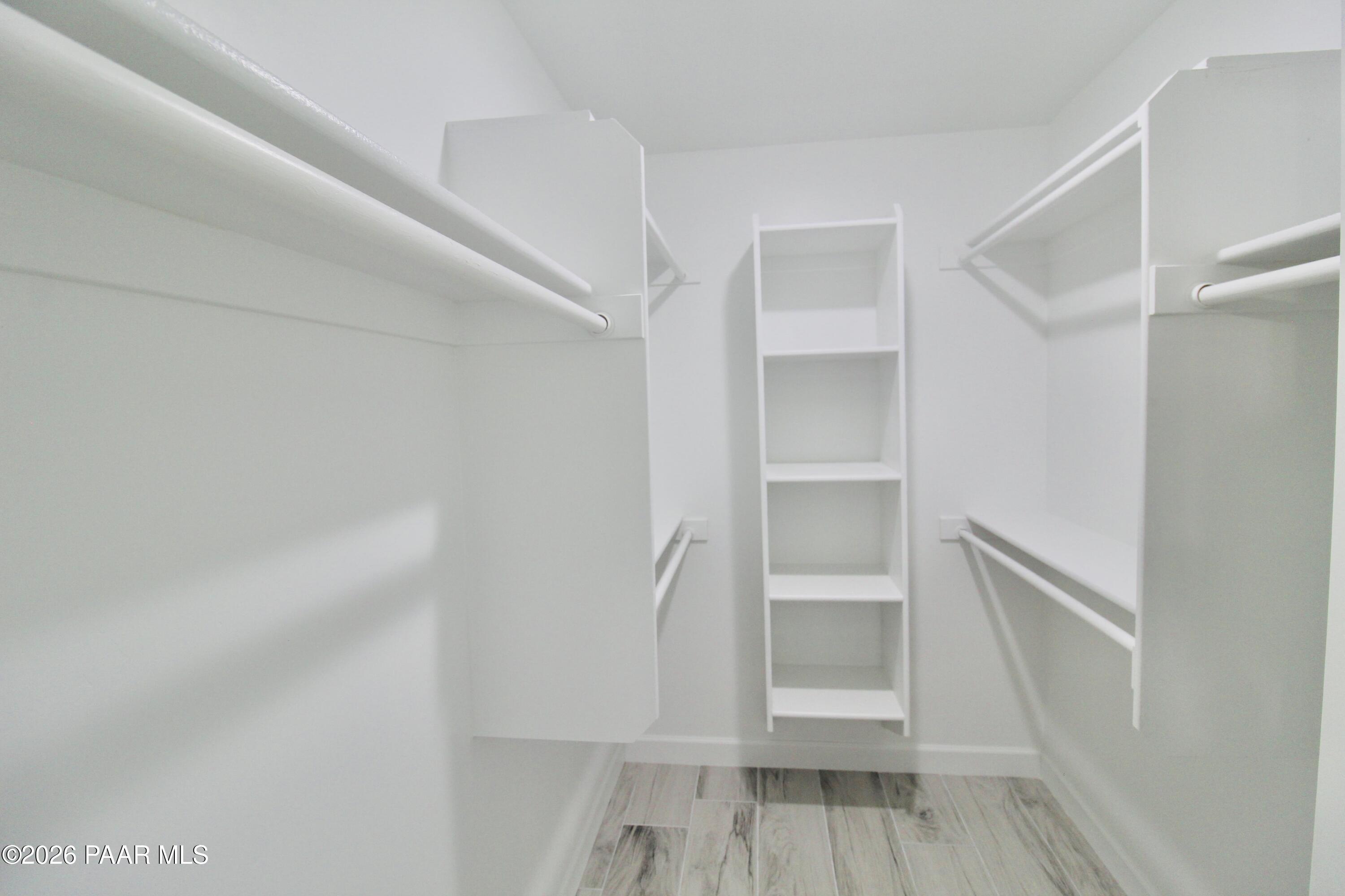 20275 East Mesa Verde Road Mayer, AZ 86333 - Photo 26 of 34 a view of walk in closet with empty racks