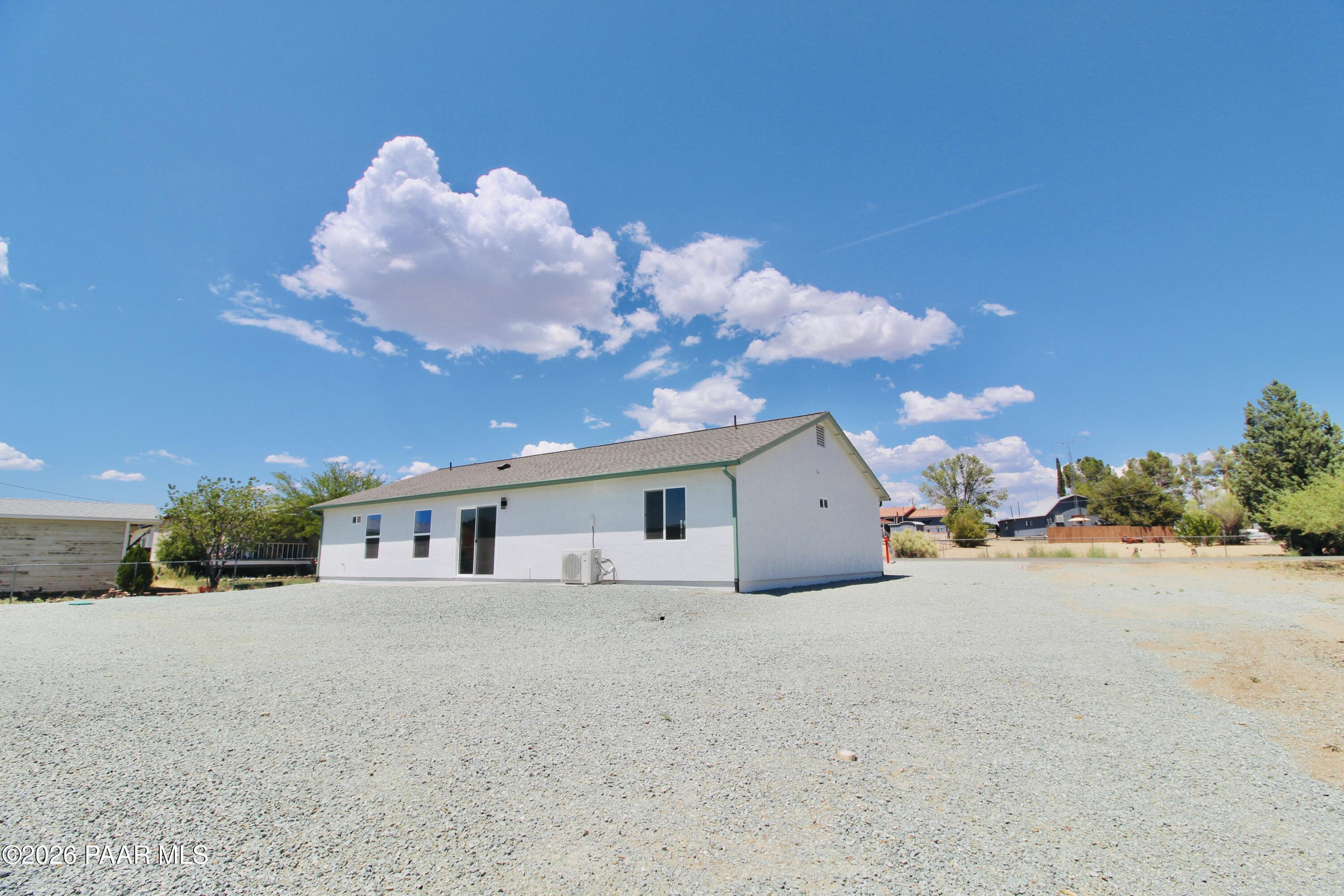 20275 East Mesa Verde Road Mayer, AZ 86333 - Photo 32 of 34 a view of a house with a yard