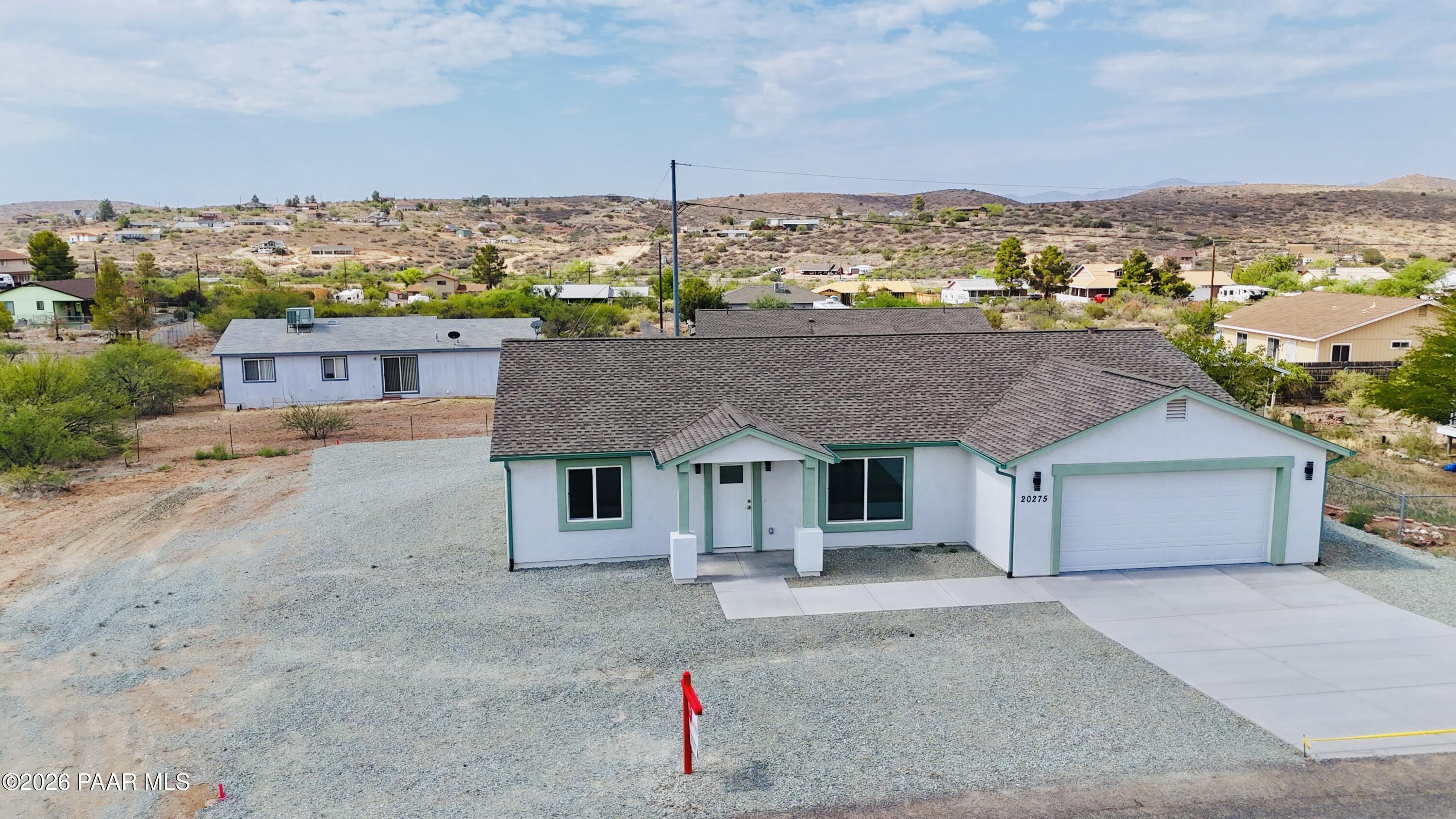 20275 East Mesa Verde Road Mayer, AZ 86333 - Photo 34 of 34 a view of a house with a terrace