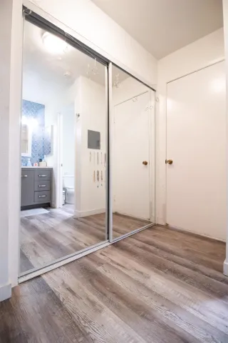 a view of a livingroom with wooden floor