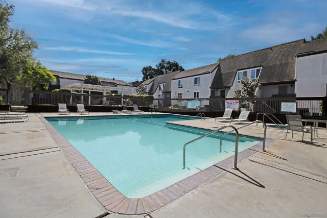 a view of a swimming pool with a patio