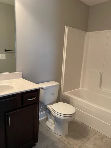 a bathroom with a sink a toilet and a bathtub