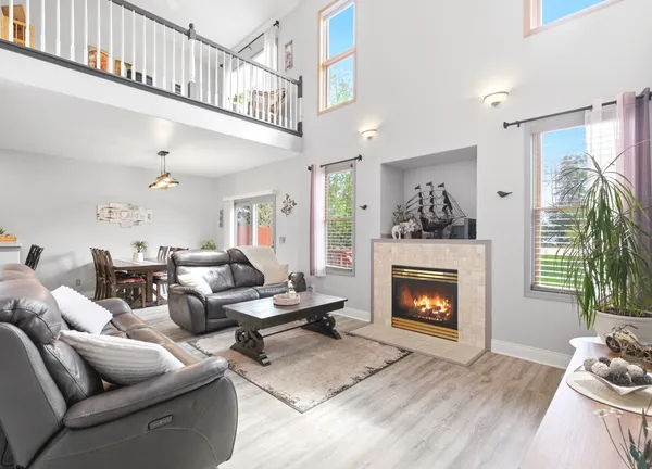 a living room with furniture and kitchen view