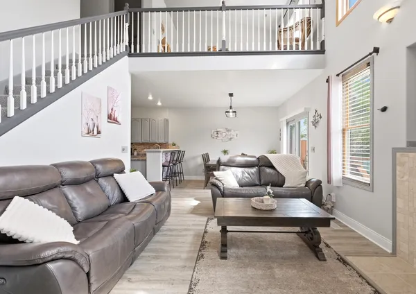 a view of balcony with wooden floor and outdoor seating