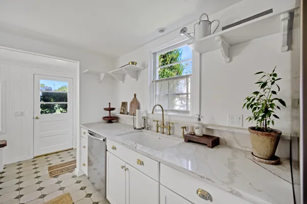 a kitchen with a sink and a window