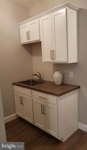 a room with cabinets and wooden floor
