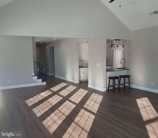 a view of a livingroom with furniture and wooden floor