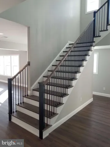 a view of entryway with wooden floor