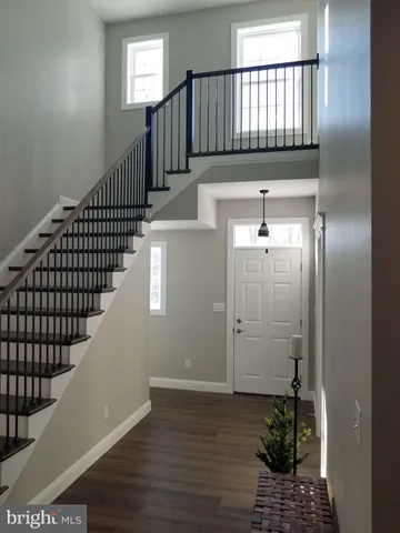 a view of entryway with wooden floor