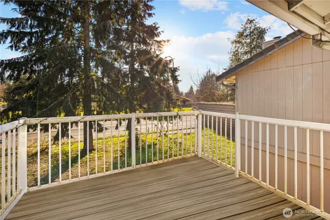 a view of deck with wooden floor and fence