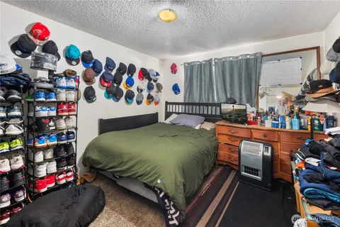 a bed room with a bed and a couch