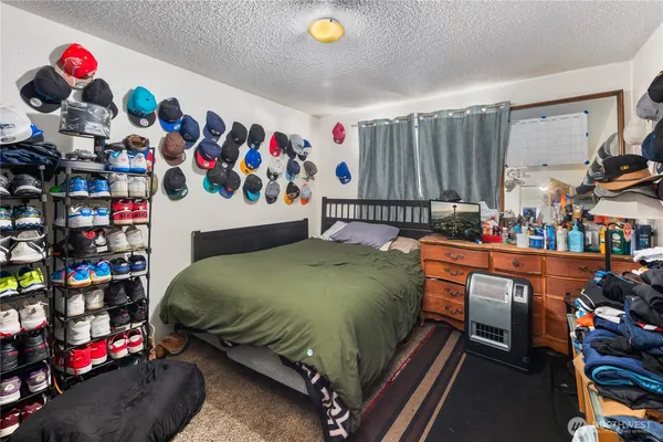 a bed room with a bed and a couch