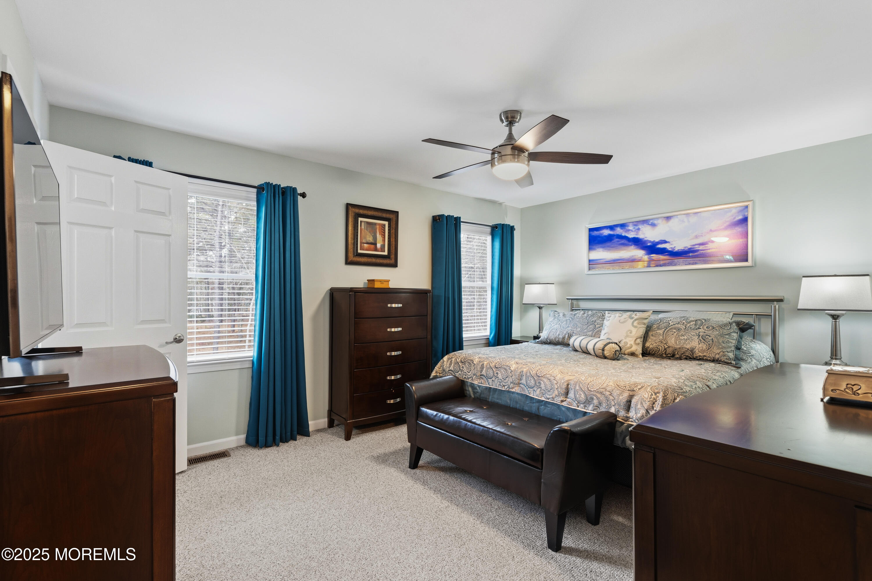 262 Frank Applegate Road Jackson, NJ 08527 - Photo 17 of 37 a bedroom with a bed and a chandelier