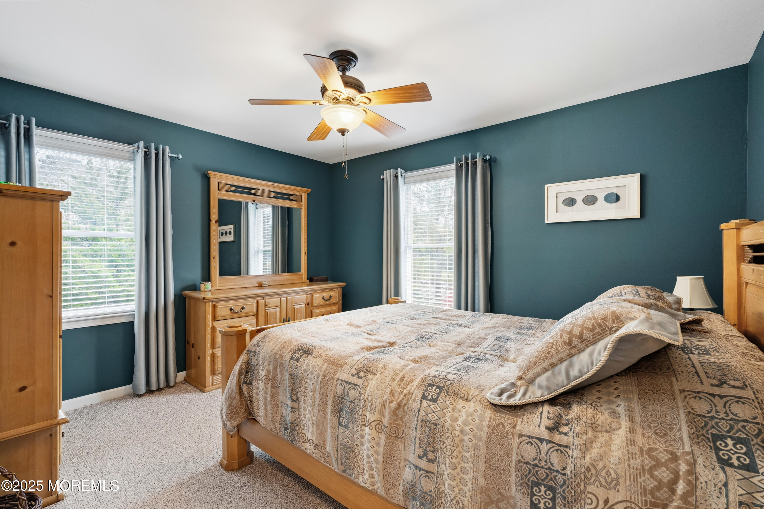 262 Frank Applegate Road Jackson, NJ 08527 - Photo 20 of 37 a bedroom with a bed and a chandelier