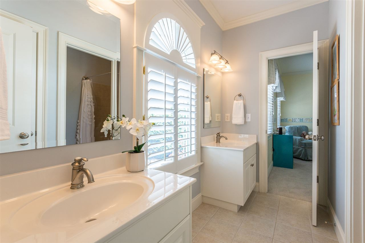 1716 Stannard Trail Raleigh, NC 27612 - Photo 19 of 30 The Jack and Jill bath provides double vanities, a tub/shower combination, tile floors, and plantation shutters. Jack and Jill Bath for Bedroom #2 and #3